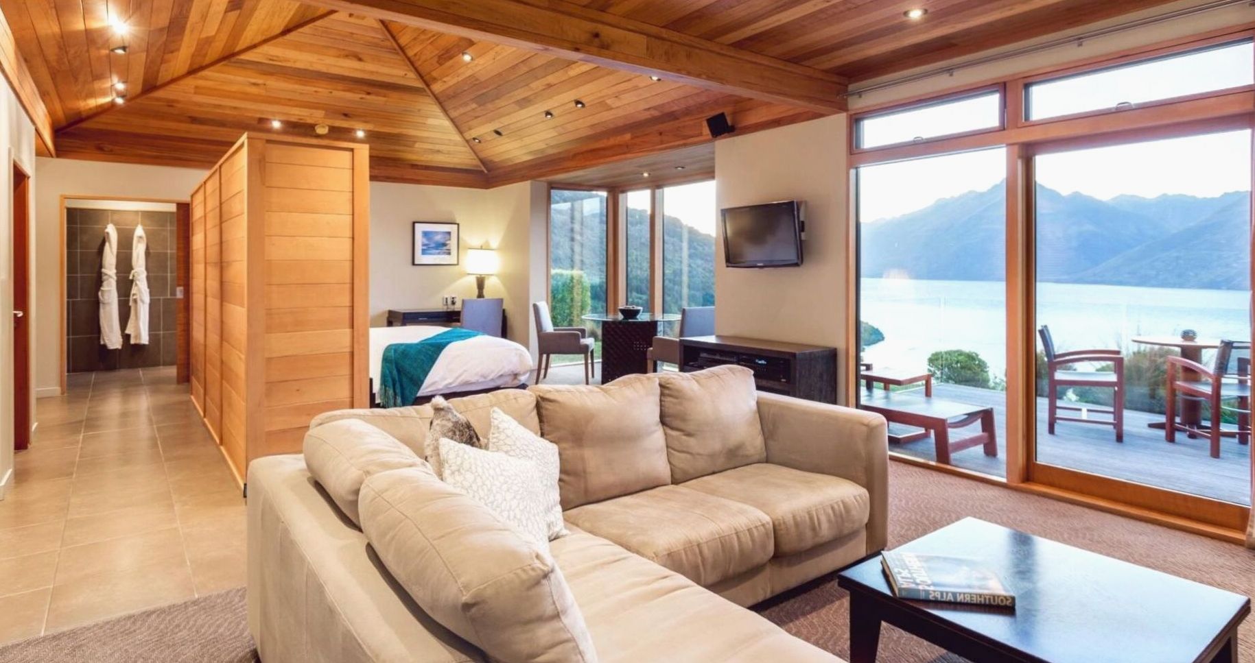 Luxury suite with spacious lounge, soft gold accents and panoramic city view
